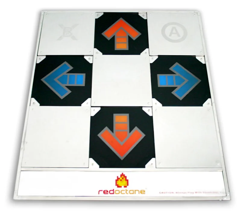 A shiny metal DDR pad with red and blue colored directional arrows.
